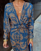 Women's boho maxi dress with V-neckline and twist front detail, full-length boho print