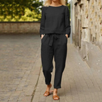 Women 2 piece blouse and trouser set with round neckline and long sleeves