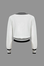 Women's knit two-piece set with cropped cardigan and wide-leg pants, black and white