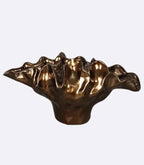 Decorative bronze resin bowl used as tabletop vase and sculptural centerpiece