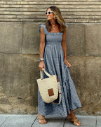 Women flutter sleeve maxi dress with fitted bodice and flowing skirt