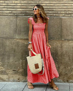 Women flutter sleeve maxi dress with fitted bodice and flowing skirt