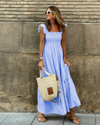 Women flutter sleeve maxi dress with fitted bodice and flowing skirt