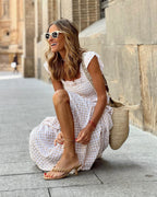 Women flutter sleeve maxi dress with fitted bodice and flowing skirt