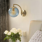 Wall lamp curved arm spherical ribbed glass shade gold finish modern indoor