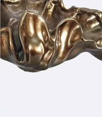 Decorative bronze resin bowl used as tabletop vase and sculptural centerpiece