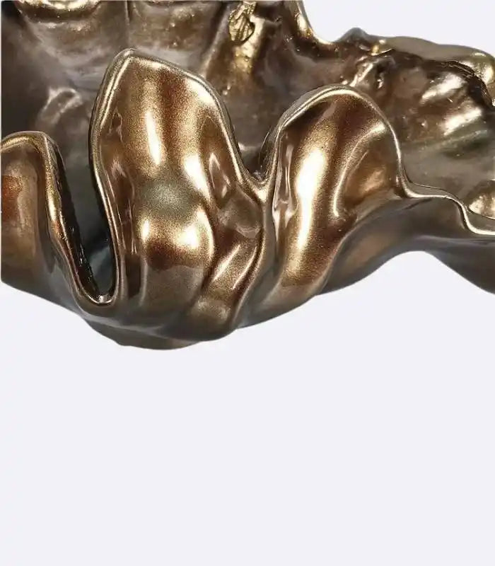 Decorative bronze resin bowl used as tabletop vase and sculptural centerpiece
