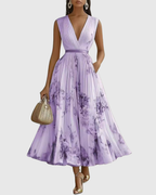 Pleated maxi dress V-neck long sleeve with ribbon-tie waist and floral pattern