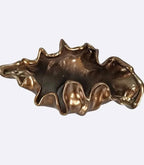 Decorative bronze resin bowl used as tabletop vase and sculptural centerpiece