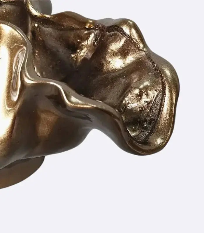Decorative bronze resin bowl used as tabletop vase and sculptural centerpiece