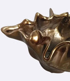 Decorative bronze resin bowl used as tabletop vase and sculptural centerpiece
