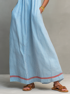Women's striped maxi dress with spaghetti straps and red trim detail