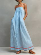 Women's striped maxi dress with spaghetti straps and red trim detail