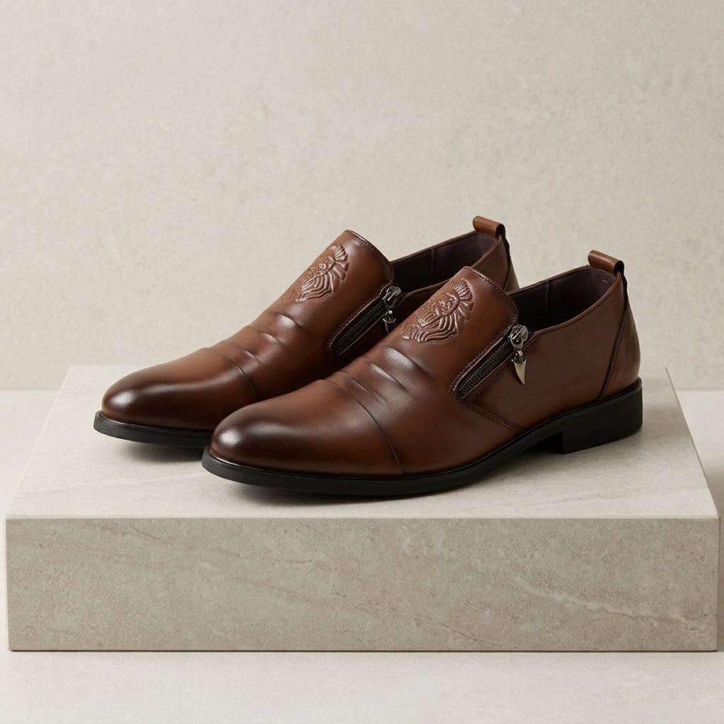 Men's leather dress shoes with lion embossed detail and side zip closure