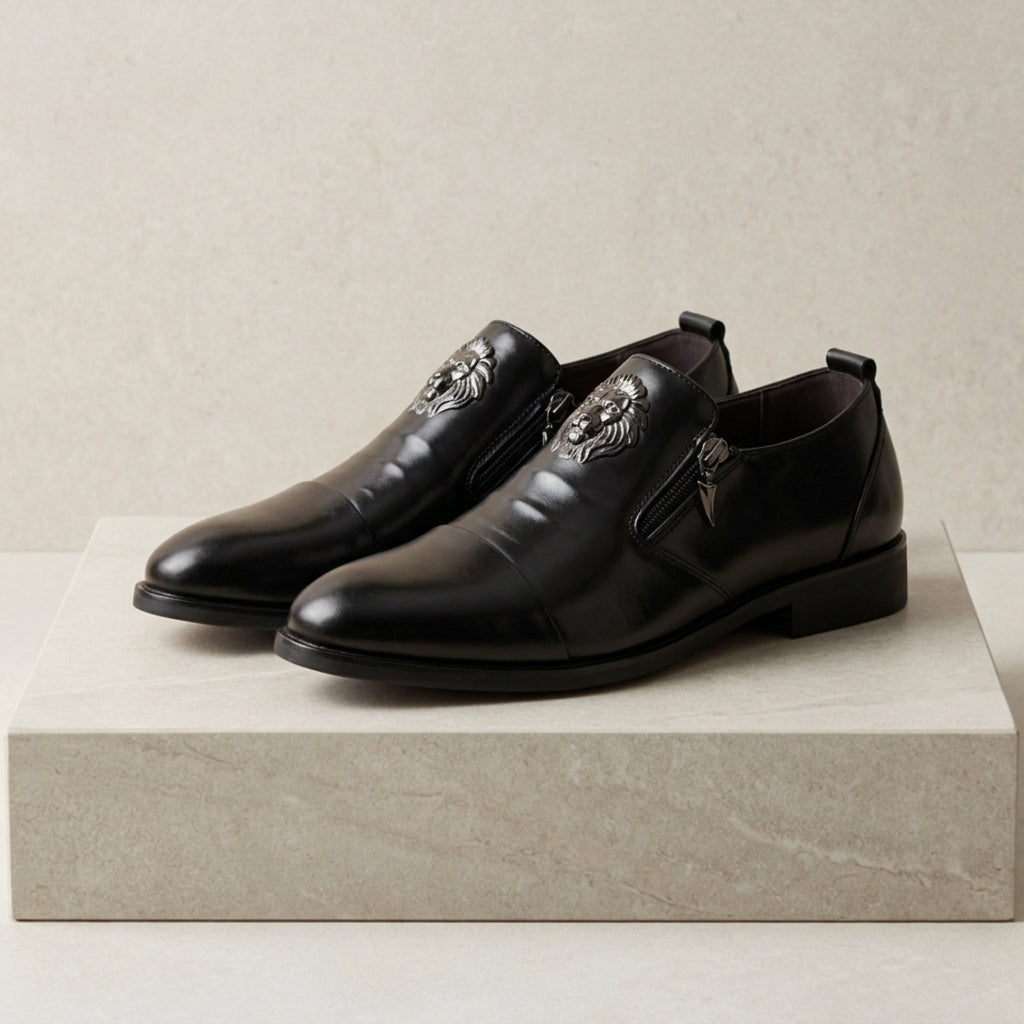 Men's leather dress shoes with lion embossed detail and side zip closure