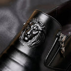 Men's leather dress shoes with lion embossed detail and side zip closure