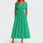 Women's midi dress with surplice V-neckline, elbow sleeves and side pockets