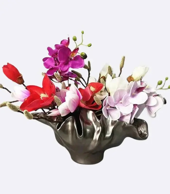Decorative bronze resin bowl used as tabletop vase and sculptural centerpiece