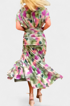 Women's floral midi dress with V-neckline and pleated waist, elegant long flowing skirt
