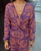 Women's boho maxi dress with V-neckline and twist front detail, full-length boho print