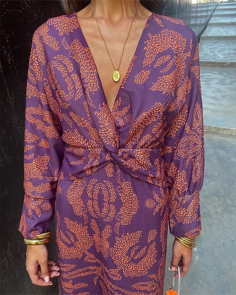 Women's boho maxi dress with V-neckline and twist front detail, full-length boho print