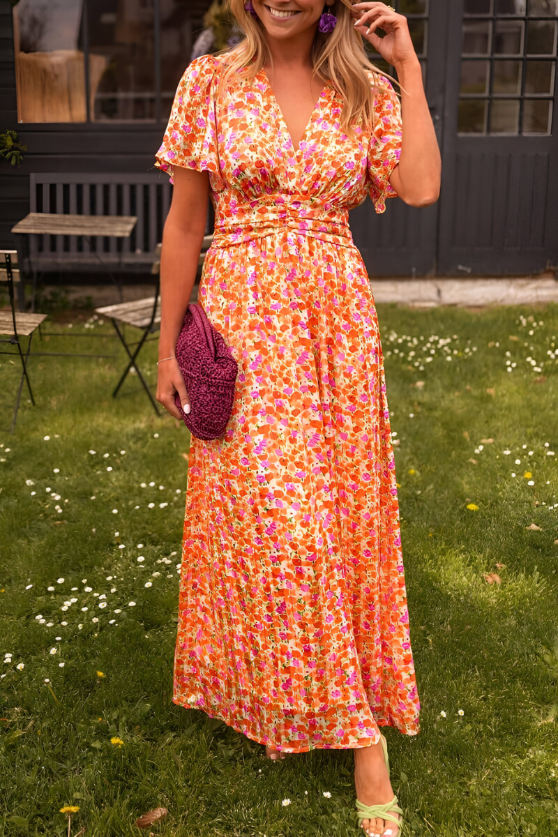 Women's floral maxi dress with deep V-neckline and fitted waist, summer style