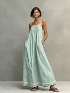 Women's striped maxi dress with spaghetti straps and red trim detail