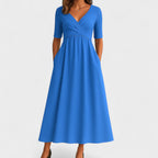 Women's midi dress with surplice V-neckline, elbow sleeves and side pockets