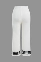 Women's knit two-piece set with cropped cardigan and wide-leg pants, black and white