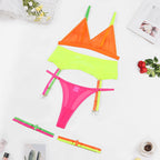 Neon lingerie set with EDM rave design in yellow, hot pink, and orange