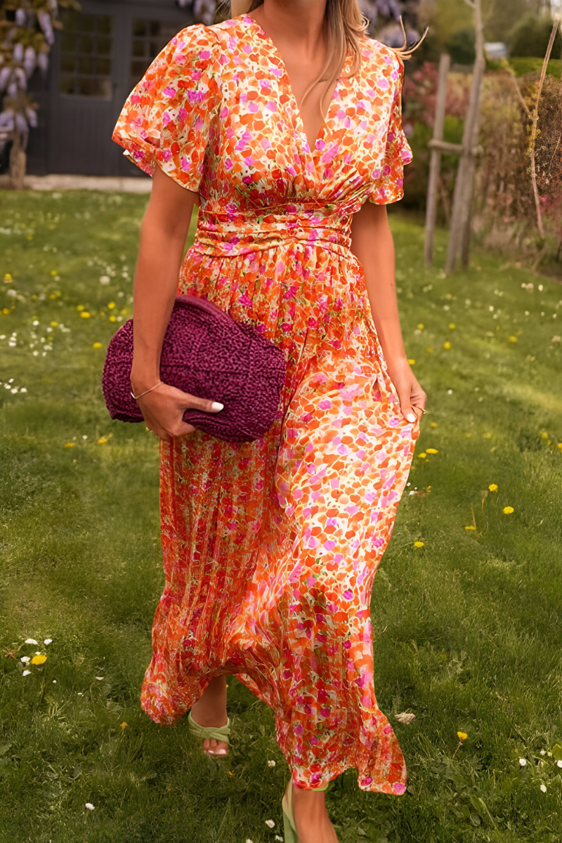 Women's floral maxi dress with deep V-neckline and fitted waist, summer style