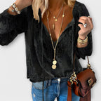 Women's embroidered blouse with deep V-neck, tie strings, long flowy sleeves and eyelet detail