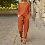 Women 2 piece blouse and trouser set with round neckline and long sleeves
