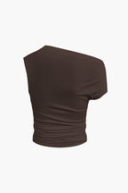Women's two-piece set with one-shoulder top and draped mini skirt, asymmetric knot detail