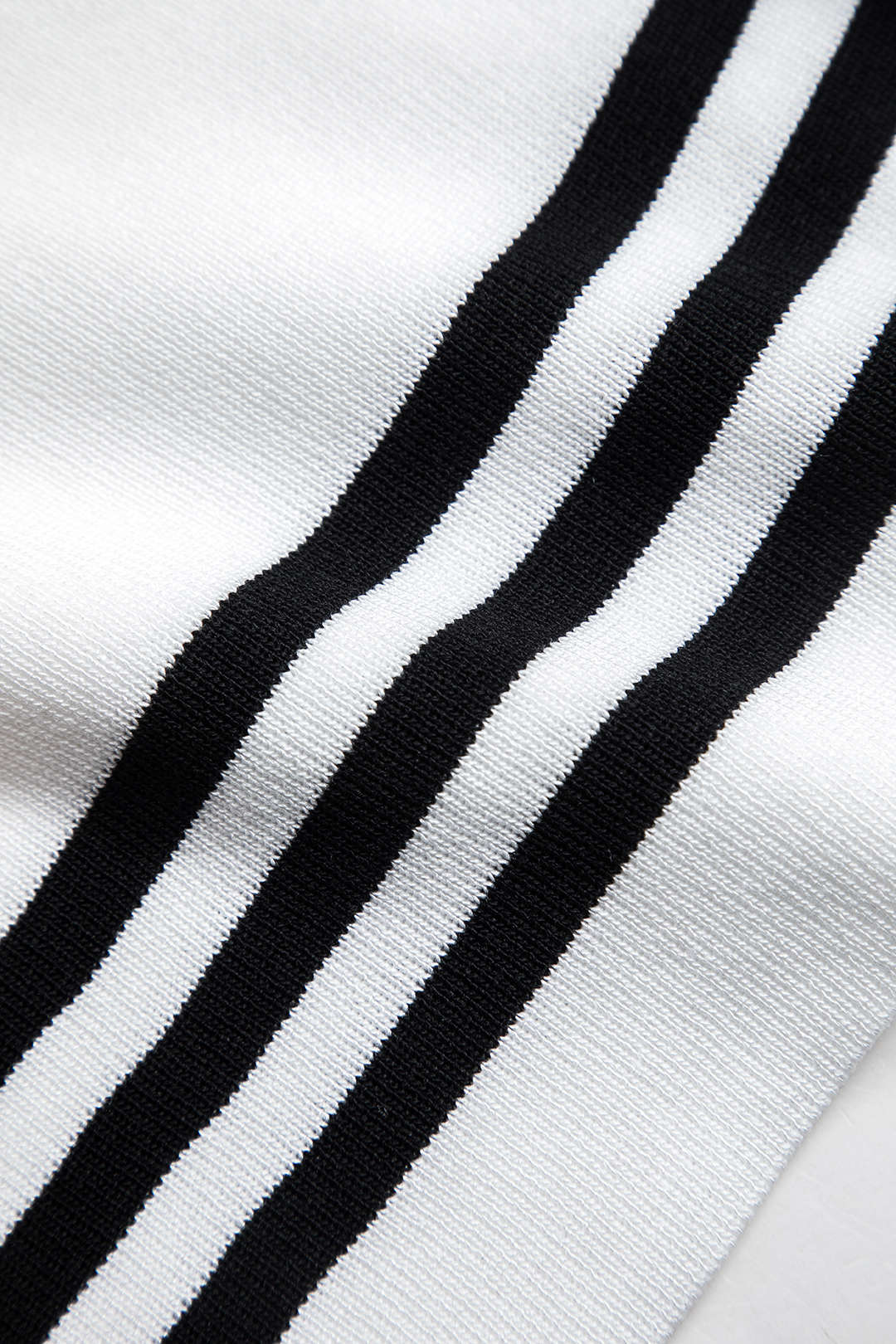 Women's knit two-piece set with cropped cardigan and wide-leg pants, black and white