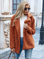 Women's mid-length coat with classic lapel collar, tailored fit outerwear