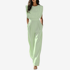 Women's jumpsuit with belted waist, minimalist elegant style, available in beige black olive