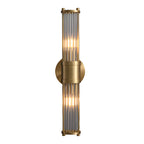 Modern wall lamp with cylindrical ribbed clear glass shade in chrome or gold finish