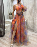 Evening maxi dress one-shoulder with floral appliqué and high leg slit