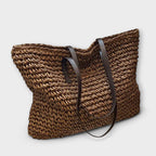 Women woven straw shoulder bag with firm top handle in natural texture