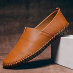Men pebbled grain leather look slip on loafers with whipstitch sole detail