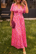 Women's floral maxi dress with deep V-neckline and fitted waist, summer style