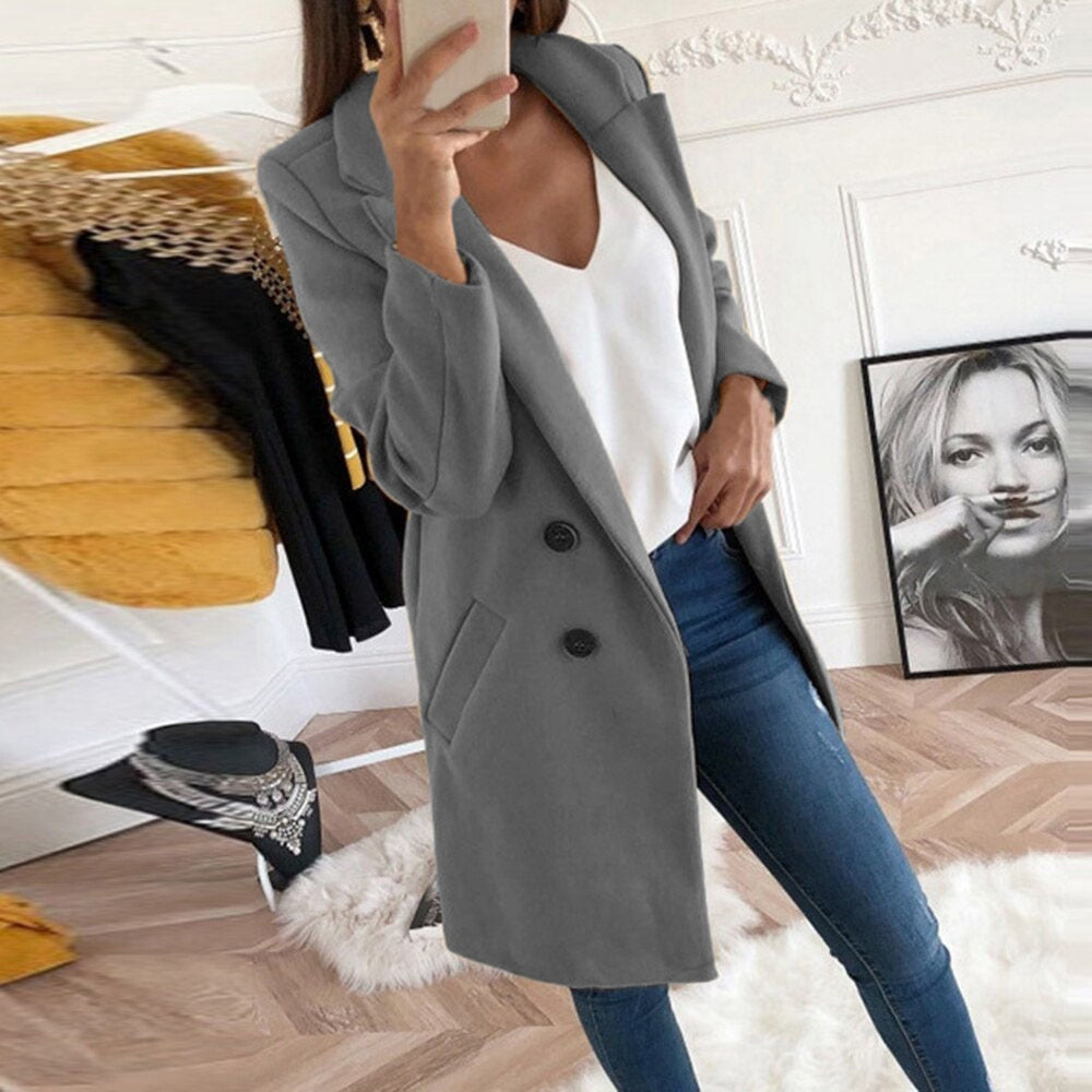 Women's long button-up coat with side pockets, elegant elongated silhouette