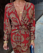 Women's boho maxi dress with V-neckline and twist front detail, full-length boho print