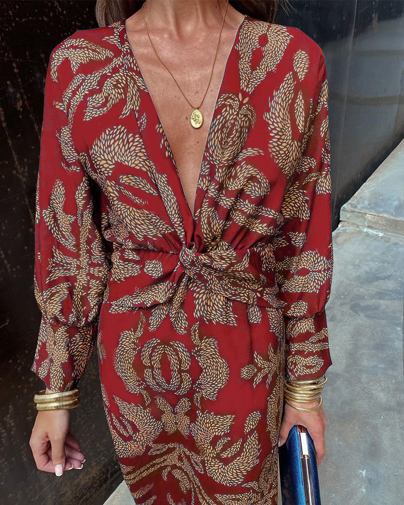 Women's boho maxi dress with V-neckline and twist front detail, full-length boho print