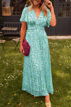 Women's floral maxi dress with deep V-neckline and fitted waist, summer style