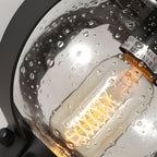 Outdoor wall lantern black seeded glass globe LED curved arm 1-light