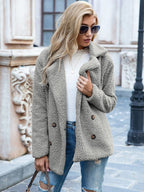 Women's mid-length coat with classic lapel collar, tailored fit outerwear