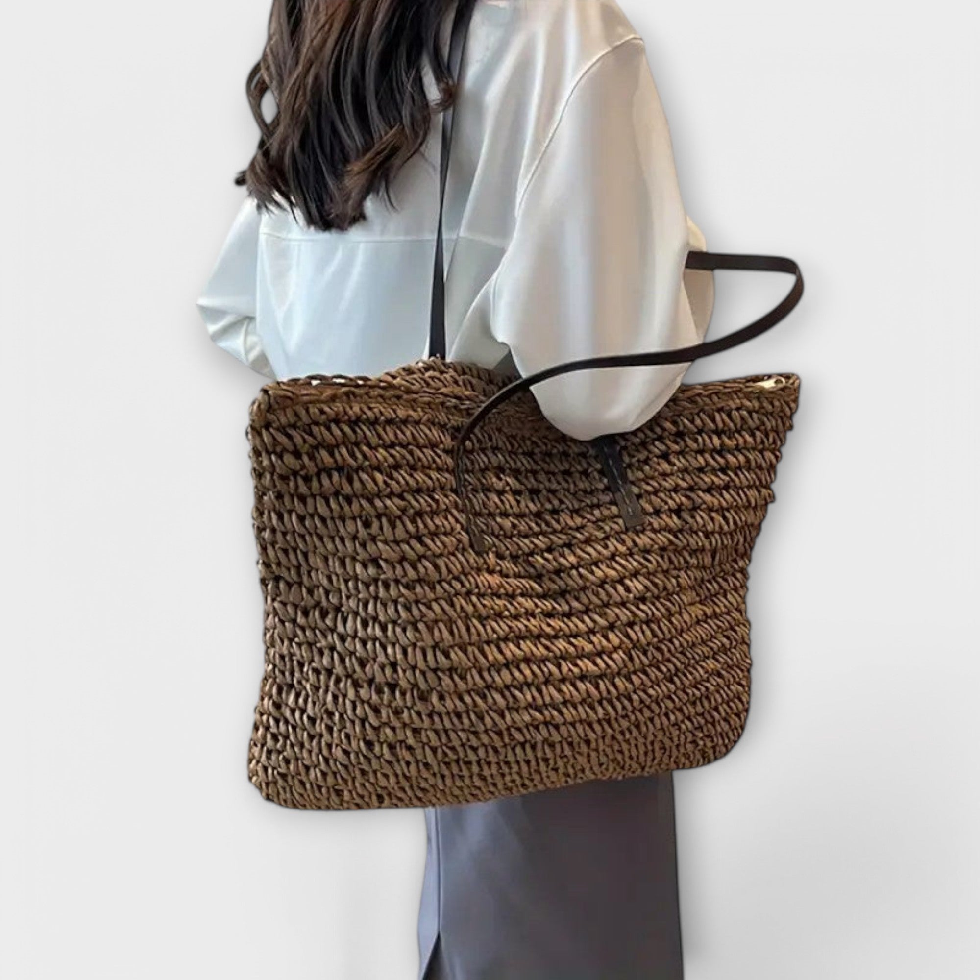 Women woven straw shoulder bag with firm top handle in natural texture