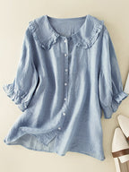 Women's lightweight ruffle collar blouse with button-front closure, elegant and feminine